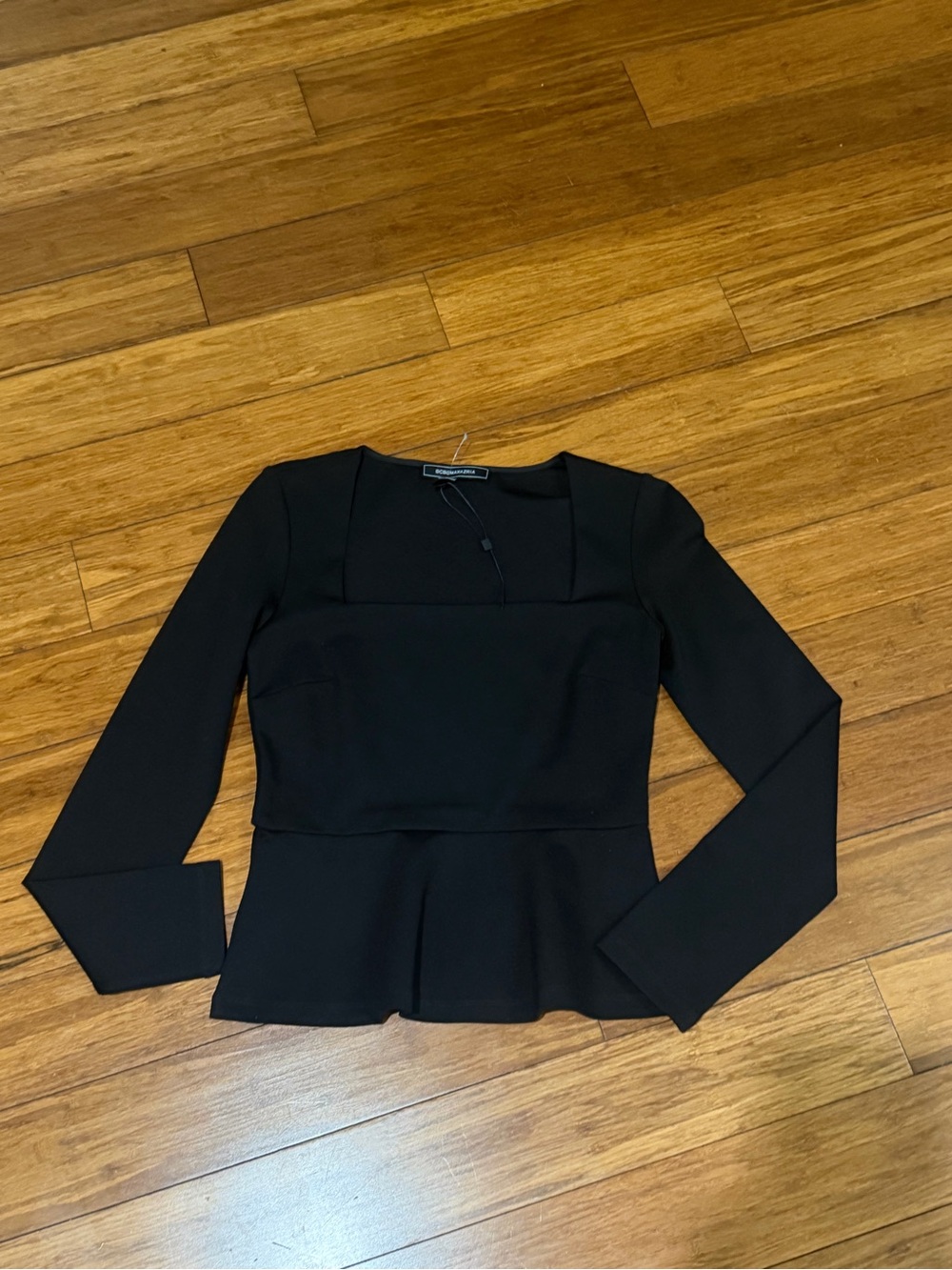NWOT BCBGMAXAZRIA long-sleeve structured peplum top in black XS